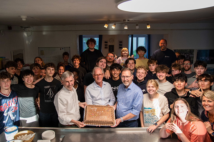 Celebrating with a cake Holding up a cake for the 70 year anniversary